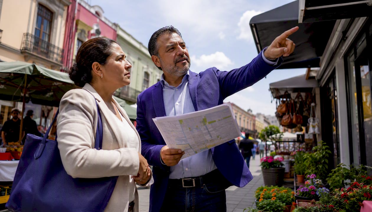 Owner and broker discussing dry cleaner storefront location